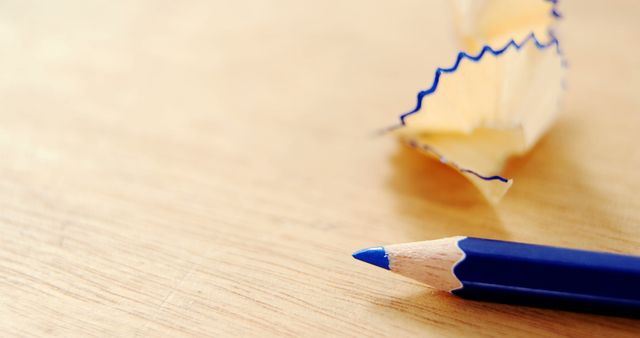 Close-up of Sharpened Blue Pencil on Wooden Desk - Download Free Stock Images Pikwizard.com