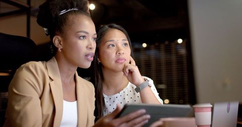 Two Businesswomen Collaborating in a Modern Office Environment