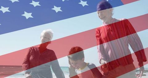 Multigenerational Family Beach Stroll Under US Flag Overlay