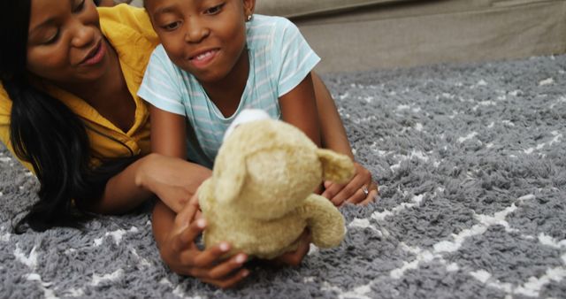 Mother and Daughter Spending Playful Time Together with Teddy Bear - Download Free Stock Images Pikwizard.com