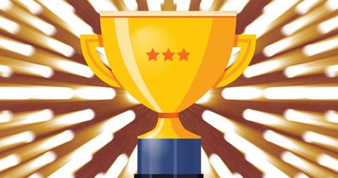 Gold trophy with stars against radiant spotlight