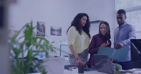 Team Collaboration at Modern Office Desk with Technology
