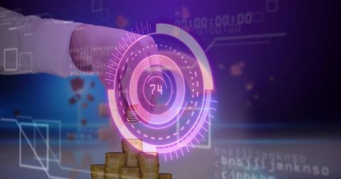Hand placing coin on stacked gold coins with holographic fintech hud interface