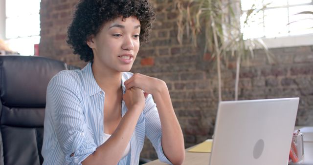 Young Woman Participating in Online Meeting in Office - Download Free Stock Images Pikwizard.com