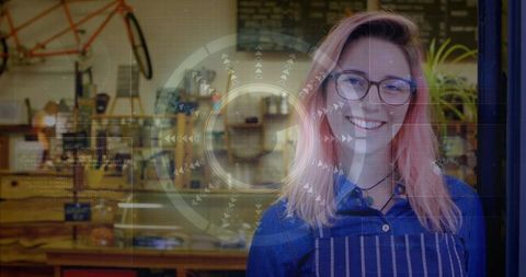 Artisan woman smiling in bicycle workshop cafe