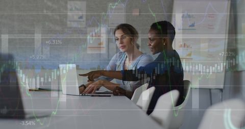 diverse businesswomen analyzing financial data on laptop - Download Free Stock Images Pikwizard.com