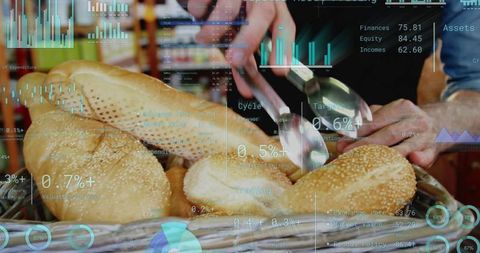Hands selecting sesame bagels with tongs in bakery basket overlaid with data analytics