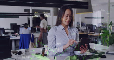 Businesswoman Using Digital Tablet in a Tech Office