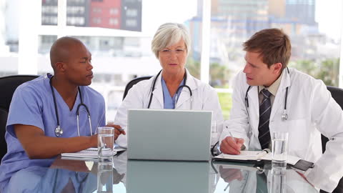 Diverse Medical Team Collaborating in Modern Office Setting