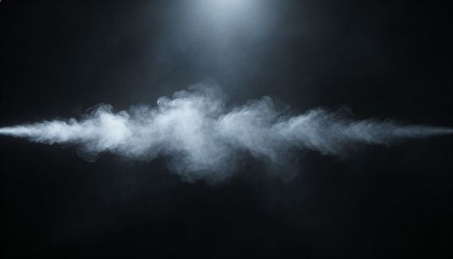 Dramatic horizontal white smoke plume glowing in spotlight over dark moody background