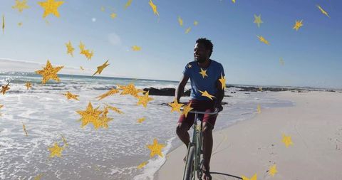Man Cycling by Ocean with Fantasy Star Overlays