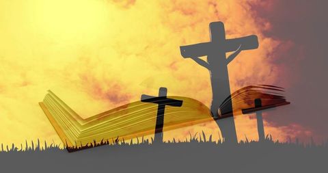 Open bible blending with crucifixion silhouette at sunset