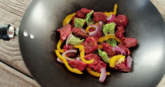 Colorful Stir-Fry with Beef and Vegetables in Wok on Wooden Table - Download Free Stock Images Pikwizard.com