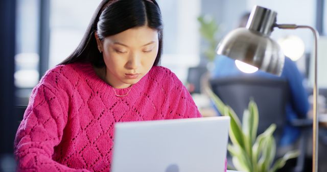Asian Businesswoman Using Laptop in Modern Office with Minimalist Design - Download Free Stock Images Pikwizard.com