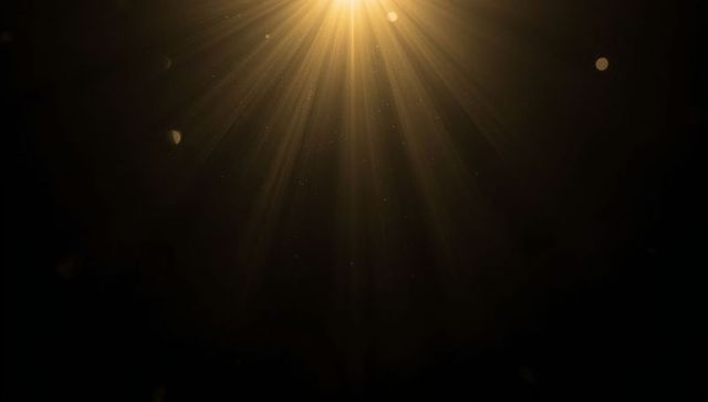 Radiant Golden Light Beams in Dark Atmosphere