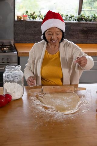 Senior Woman Baking Festive Cookies in Cozy Kitchen Atmosphere