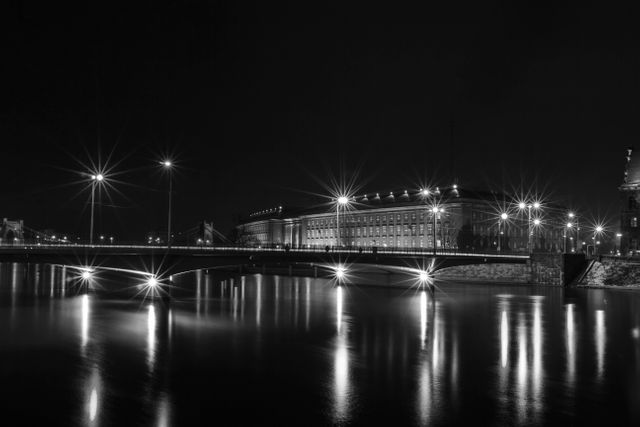 Night Cityscape with Illuminated Bridge Reflecting on River - Download Free Stock Photos Pikwizard.com