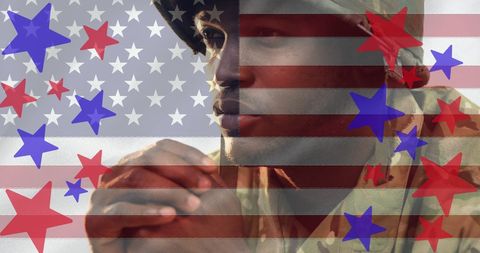 Thoughtful Soldier Silhouette Overlaid with American Flag and Stars
