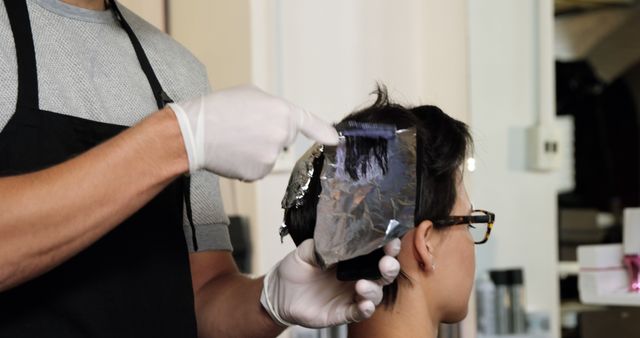 Hairdresser Dyeing Hair with Foil Technique in Salon - Download Free Stock Images Pikwizard.com