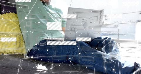 Working from home on laptop in sunlit bedroom with digital interface overlay