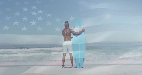 Surfer holding board on beach with patriotic vibe