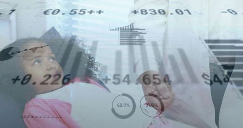 Pediatric doctor holding child on exam table displaying healthcare data overlays and charts