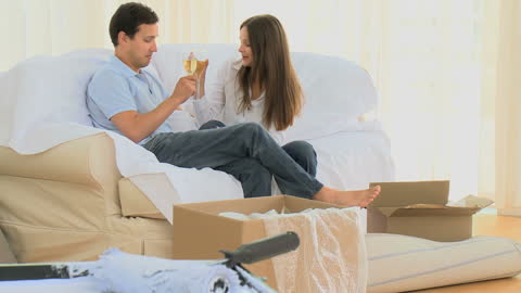 Couple Celebrating New Home with Champagne Toast