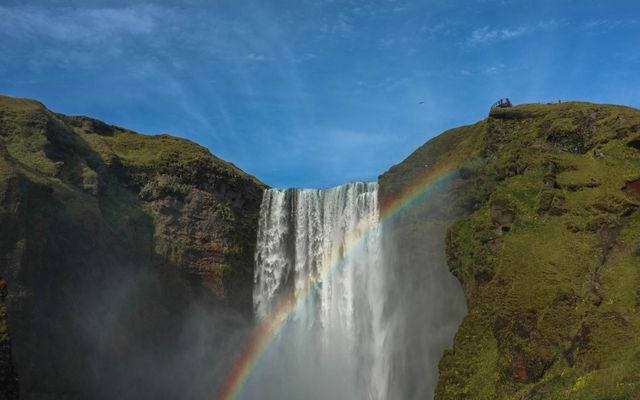 Rainbow over Majestic Waterfall in Lush Mountain Landscape - Download Free Stock Photos Pikwizard.com