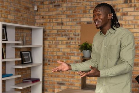 Professional Man Speaking Emphasizing Points Inviting Collaboration