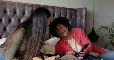 Couple Packing Together Prior to Vacation Enjoying Fun