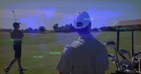 Golfers analyzing shots with trajectory technology on scenic fairway