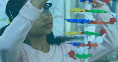 Biracial Girl Conducting STEM Experiment with Molecular Model and Mathematics