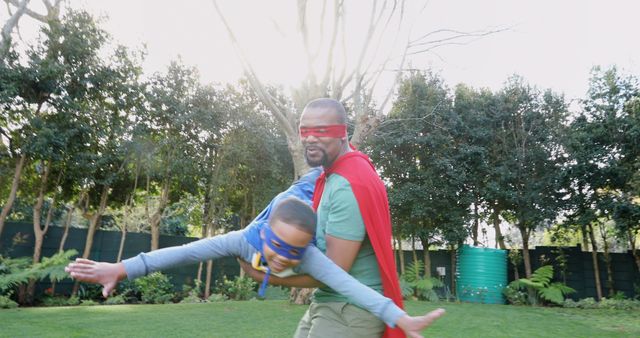 Father and Son Playing in Superhero Costumes in Garden - Download Free Stock Images Pikwizard.com