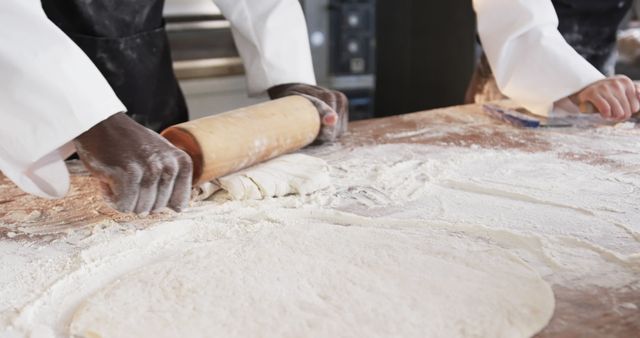 Hands Rolling Dough in Professional Bakery Kitchen - Download Free Stock Images Pikwizard.com