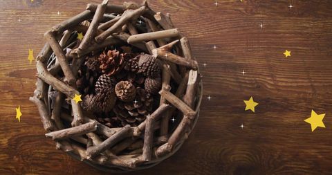 Rustic autumn wreath with pinecones and festive stars on wooden surface