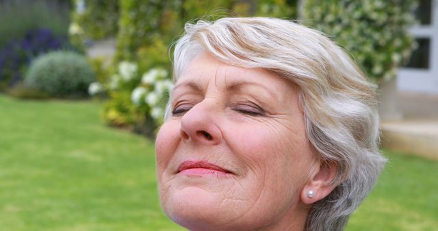 Senior Woman Relaxing Outdoors with Eyes Closed - Download Free Stock Images Pikwizard.com