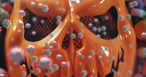 Halloween Mask with Floating Virus Cells Candy Background