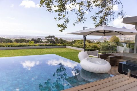 Luxury infinity pool terrace with floating ring lounge and parasol overlooking cityscape