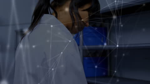 Asian Scientist Exploring Digital Innovation in Lab