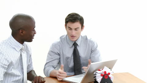 Young Multiracial Businessmen Collaborating at Office Desk