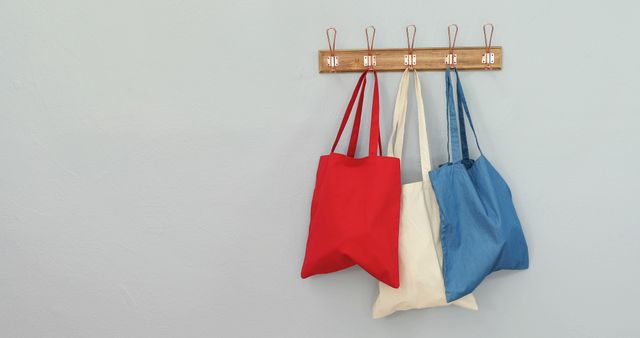 Colorful Reusable Eco Bags Hanging on Wall Hooks - Download Free Stock Images Pikwizard.com
