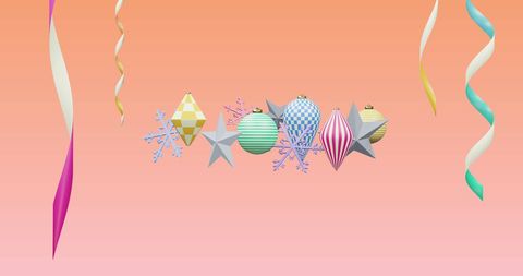 Colorful ornaments with ribbons on pink gradient background