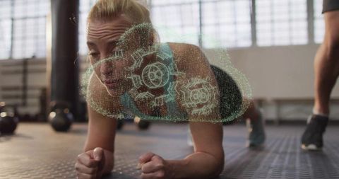 Focused Woman in Plank with Holographic Gears in Modern Gym