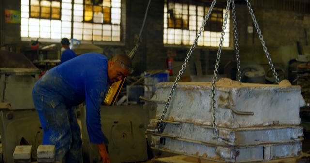 Factory Worker Operating Heavy Machinery in Industrial Setting - Download Free Stock Images Pikwizard.com