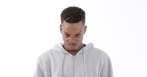 Man in Gray Hoodie with Focused Expression - Download Free Stock Images Pikwizard.com