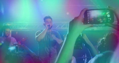 Vibrant Live Concert Scene with Colorful Lights and Audience