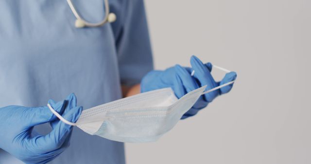 Healthcare Professional Holding Protective Surgical Mask and Gloves - Download Free Stock Images Pikwizard.com