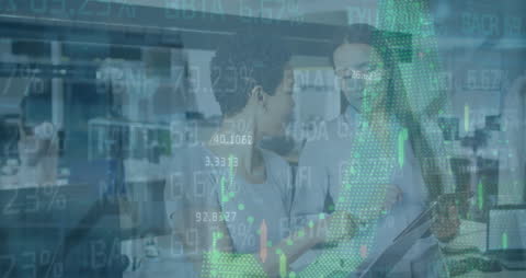 Diverse Colleagues Collaborating with Digital Financial Data Overlay