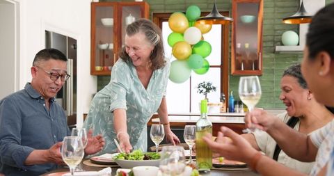 Diverse Seniors Enjoying Dinner Celebration at Home