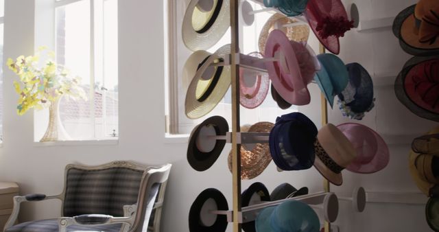 Panning shot of the showroom at a hat factory, with various hats on display in the fore and background, in slow motion